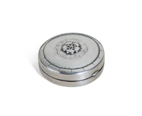 Georg Jensen (1866-1935), a Danish silver pill box, pattern no. 79, of circular form and relief moulded with a central rose, 