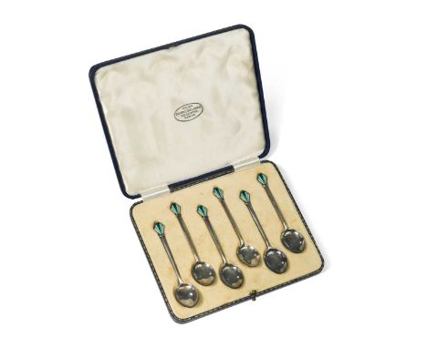 A cased set of six silver and enamel teaspoons by William Hair Haseler, Birmingham, 1913, each with fan finials enamelled in 