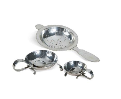 Georg Jensen (1866-1935), two open silver salts and spoons, pattern no. 110, each with scrolling loop handles terminating at 