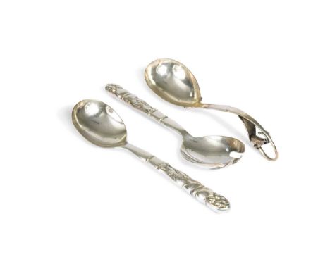 Georg Jensen (1866-1935), a pair of silver servers, pattern no. 54, in the 'ornamental' pattern, each stem relief moulded wit