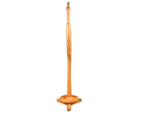 A contemporary solid ash standard lamp, the well-figured baluster column raised on a circular platform base and three feet156