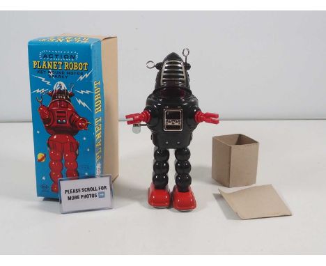 A YOSHIYA / KO (Japan) 'Action Planet Robot' clockwork 'Key Wound Motor Sparky' tinplate/plastic robot circa late 1960s / ear