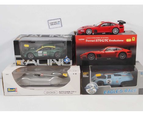 A group of four 1:18 scale racing cars by various manufacturers to include a KYOSHO Ferrari 575 GTC and a REVELL Auto Union T