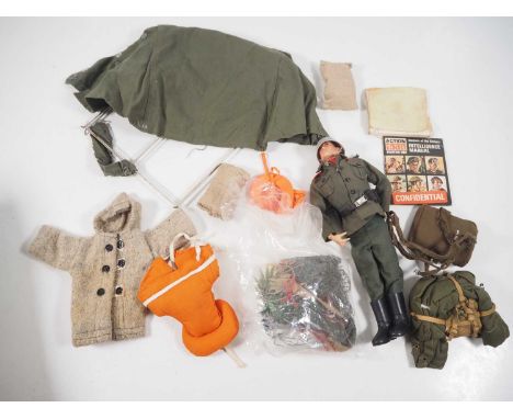 A group of PALITOY Action Man items comprising a dressed soldier figure and other military clothing and accessories - G unbox