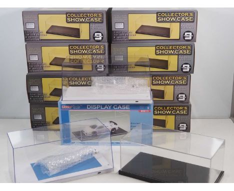 A large group of Perspex / plastic display cases suitable for 1:18 scale cars, comprising nine boxed examples, and three unbo