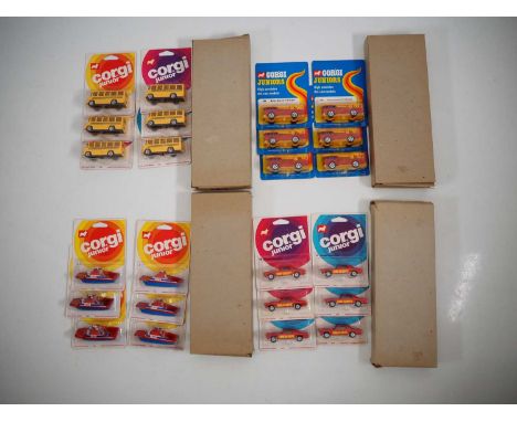 A group of CORGI JUNIORS trade boxes comprising 6x No.15 School Bus, 6x No.29 Simon Snorkel Fire Engine, 6x No.53 Frie Boat a