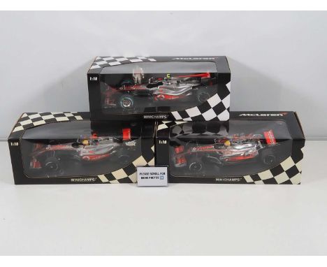 A group of MINICHAMPS 1:18 scale McLaren Mercedes Formula 1 cars, all Lewis Hamilton examples, 2008 - 2010 cars - VG/E in VG 