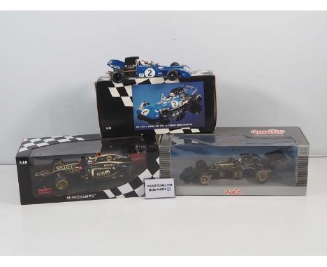 A pair of MINICHAMPS 1:18 scale mixed Formula 1 cars comprising Lotus Renault, K. Raikkonen, 2012 (signed to top left of side