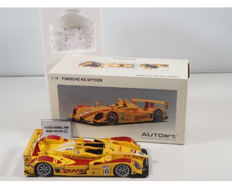 An AUTOART 1:18 scale Porsche RS Spyder race car in DHL livery - VG/E in G/VG box