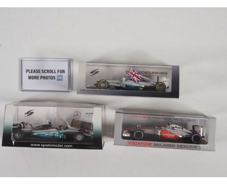 A group of SPARK 1:43 scale McLaren / Mercedes-AMG Formula 1 cars, all representing cars driven by Lewis Hamilton 2012-2017 -