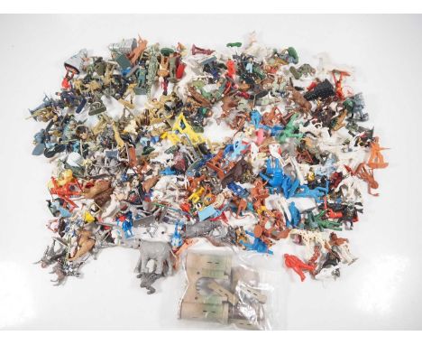 A large quantity of plastic figures to include soldiers, Cowboys & Indians etc, by BRITAINS, TIMPO, LONE STAR and others - F/