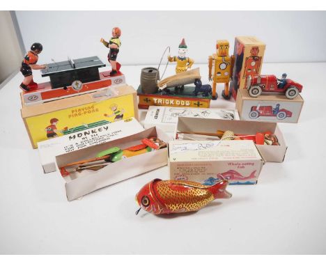 A quantity of later Chinese reproductions of vintage tinplate and cast iron toys - G/VG in G/VG boxes (where boxed)   (7)