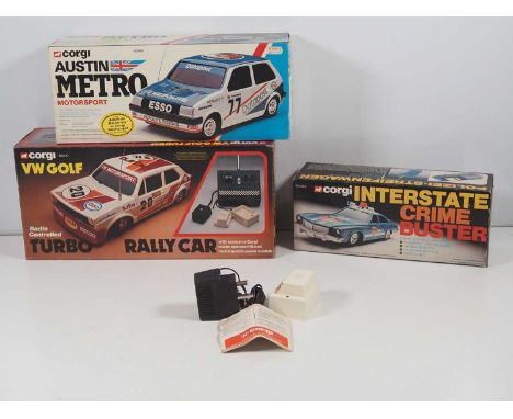 A group of CORGI battery-powered remote/radio controlled cars comprising a 'Click and Go Interstate Crime Buster' a radio con