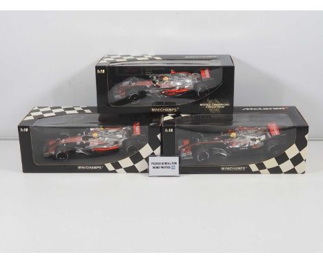 A group of MINICHAMPS 1:18 scale McLaren Mercedes Formula 1 cars, all Lewis Hamilton examples, 2006 - 2008 cars - VG/E in VG 