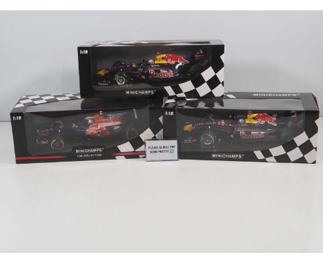 A group of MINICHAMPS 1:18 scale Torro Rosso / Red Bull Racing Formula 1 cars, all Sebastian Vettel examples, 2008 - 2011 car