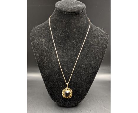 A pendant with a smokey quartz set in a 9ct gold frame on a fine chain, total 8.2g, Location: 