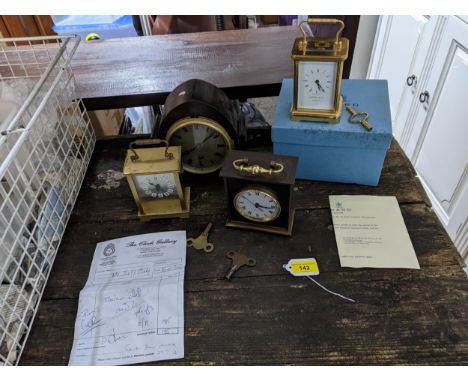 A group of carriage and mantel clocks to include a Garrard &amp; Co five-window brass cased carriage clock, with key, box and