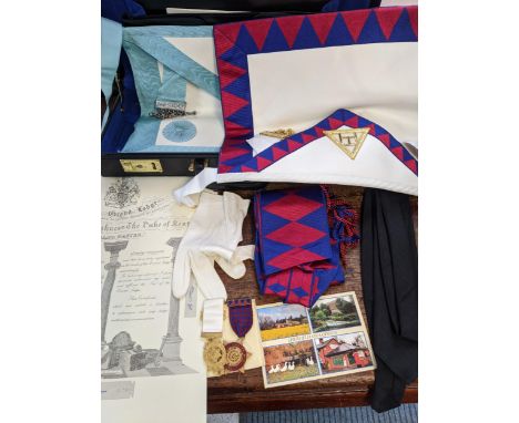 A Masonic case containing two aprons, medals, black tie and other items Location: 