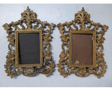 A pair of Victorian gilt metal picture frames decorated with floral scrolls and having easel backsLocation: 