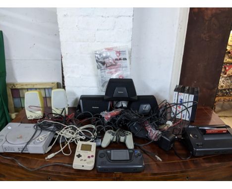 A Playstation console and games, and a Sega Master System II Power Base accessories, Nintendo Game Boy games and speakers Loc