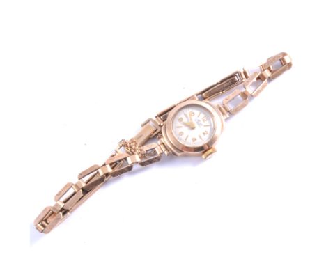 Avia - A ladies 9 carat yellow gold bracelet watch, circular cream dial alternating batons and arabic numerals in a 9 carat y