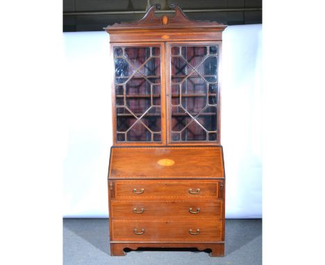 Edwardian mahogany bureau bookcase, swan-neck pediment above a moulded cornice, frieze with fan oval astragal glazed doors en
