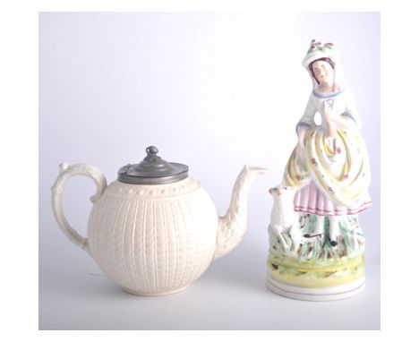 A pair of Staffordshire figures with lambs 24cm high, another Staffordshire figure group of two dancing 30cm high, a parian w