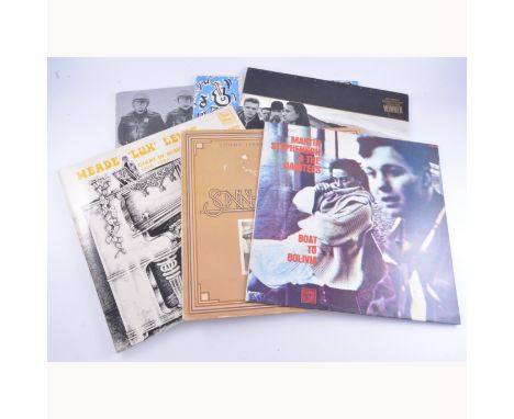 Box of mixed vinyl music records, including Bob Dylan, Queen, Van Morrison and others, approximately 70 records in total. 