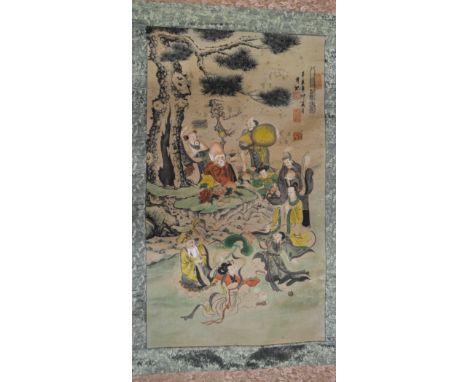 Chinese scroll, figures by a willow tree, brocade mounted, width 69cm.