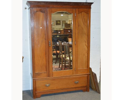 Edwardian walnut wardrobe, moulded cornice, plain frieze, central mirrored panelled door, drawer base, bracket feet, width 13