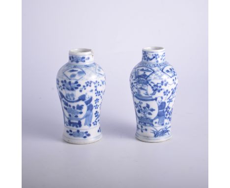 Nao pair of Chinese blue and white baluster shape vases, bearing Kangxi four-character mark, decorated with vases, paired fig