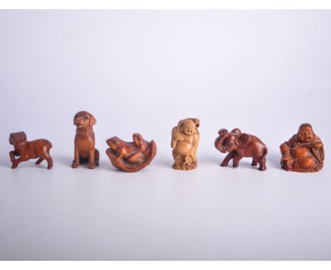 Japanese carved hardwood netsuke modelled as Buddha, 5cm; another netsuke, frogs on a lily pad; another, seated dog; and thre