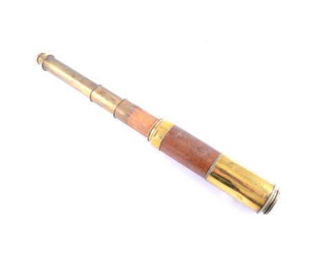 A Dolland four draw telescope with brass and oak barrel, sliding brass cover to lens and eye piece.CONDITION:End cap is stuck