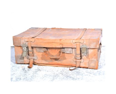 Painted metal trunk, 69cm; a leather suitcase, damaged; and another painted tin trunk (3)
