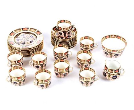 THIRTY TWO PIECE ROYAL CROWN DERBY TEA SET COMPRISING TEN CUPS, TEN SAUCERS, TEN SIDE PLATES, SUGAR BOWL & CREAM JUG. IMARI P