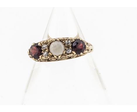 A 9ct gold Victorian style opal, topaz and garnet dress ring, the central white precious opal in scroll setting flanked by a 