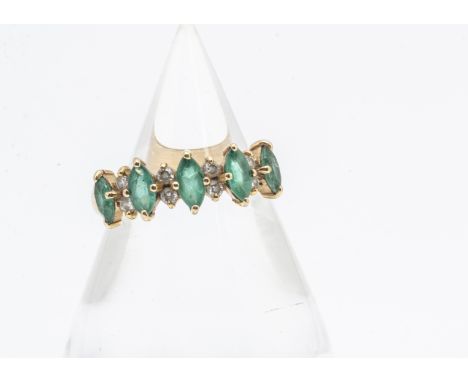 An 18ct gold emerald and diamond half hoop dress ring, the five mixed marquise cut emeralds alternately set by two pairs of b