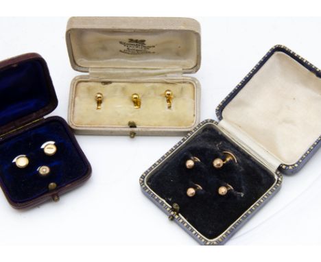 Three cased sets of dress buttons, one with mother of pearl back, all gold (3) 