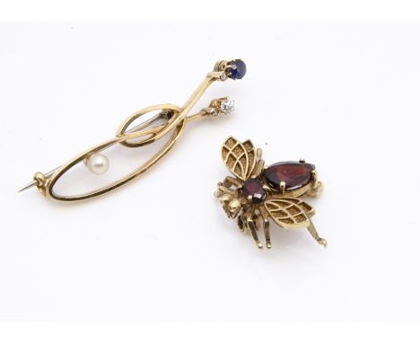 A 9ct gold and garnet bug brooch, the abdomen and body with faceted pear and oval almandine garnets marked to underside, 2.6c