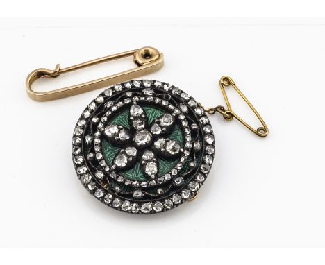 A 19th Century diamond and enamel target brooch, the rose cut diamonds in silver setting against a guilloche green enamel bac
