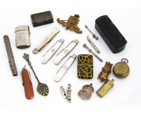 A small group of collectables, including four silver and mother of pearl handled pocket fruit knives, two small whistles, one