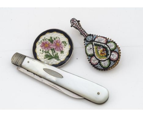A continental silver and enamel floral circular brooch, 3cm diameter together with a silver and mother of pearl folding fruit