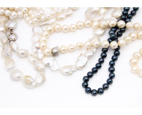 Two large strings of Baroque pearls, one with silver heart clasp, the other with a circular snap, together with a string of b