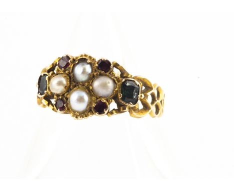 A yellow metal antique emerald, ruby and seed pearl posy ring, with pierced shoulders, engraved shank, ring size N, 2.1g 