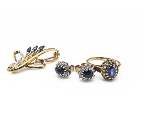 A suite of gem set jewellery, including a 9ct gold diamond and sapphire brooch, a pair of diamond and sapphire ear studs, and