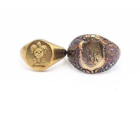 An 18ct gold lady's signet ring, with fleur de lys and leopard head, ring size M, 12g together with a gentleman's base metal 