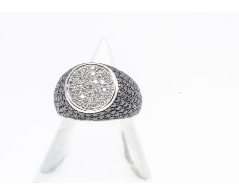 A continental 18ct white gold diamond signet ring, in white and black diamonds, ring size J, 6.3g 