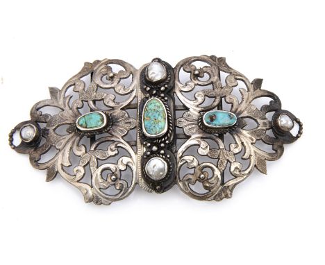 An early 20th Century white metal, mother of pearl and turquoise belt buckle, with Tunisian marks to clasp dating it to 1900,