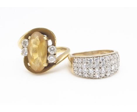 A 9ct gold and cubic zirconia dress ring, ring size N, 5.1g together with a 14ct citrine and topaz crossover scroll dress rin