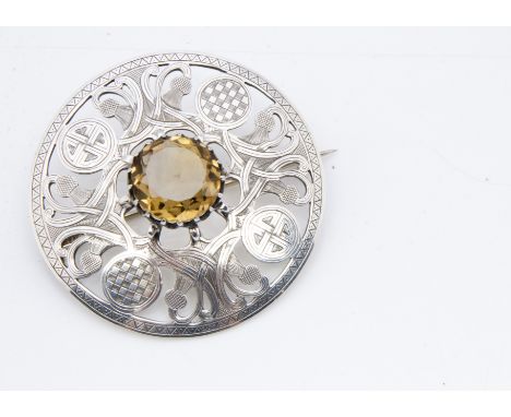 An Irish Celtic George V silver and citrine plaid brooch, dated Dublin 1912, makers JC &amp; S, 7cm diameter, 51g 